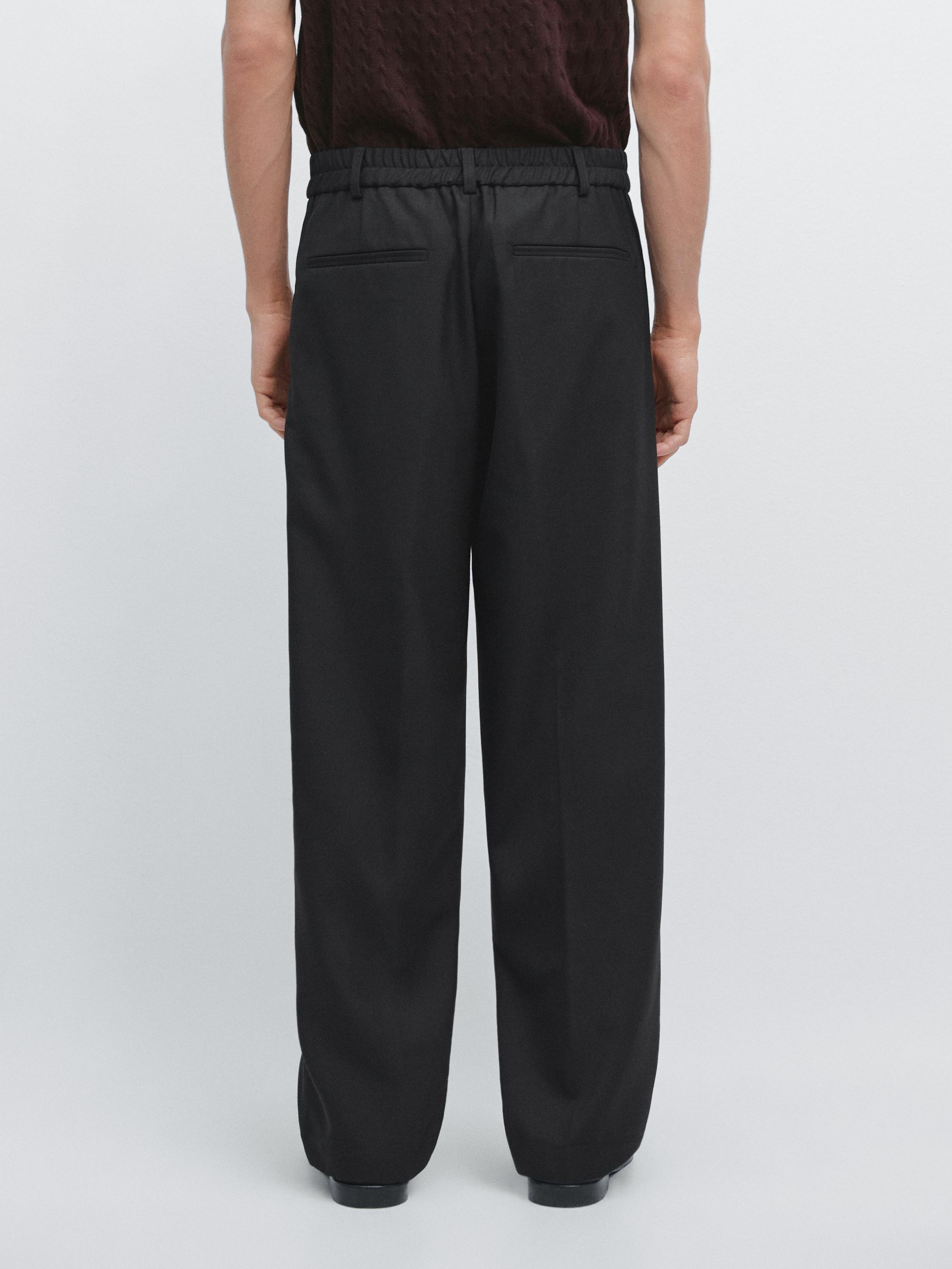 Relaxed fit wool trousers with dart detail